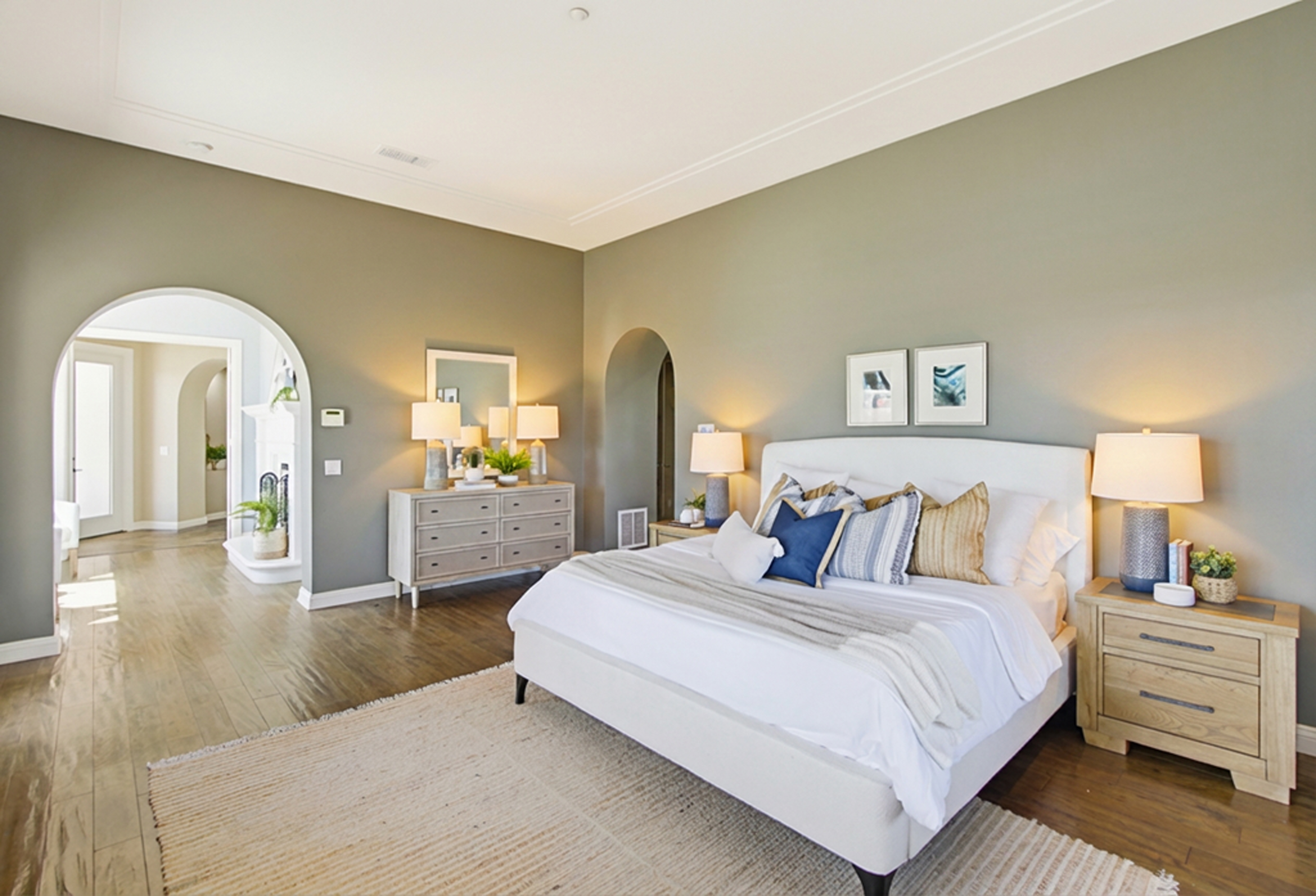 Santaluz staged primary bedroom sage green walls San Diego